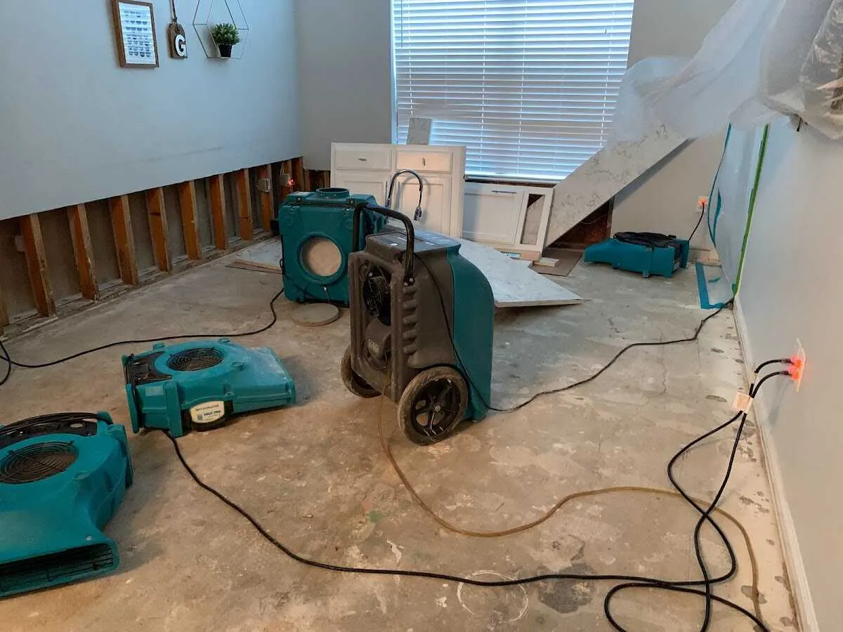 Dehumidifier in flood-cut room for Water Damage Restoration in Brownsville